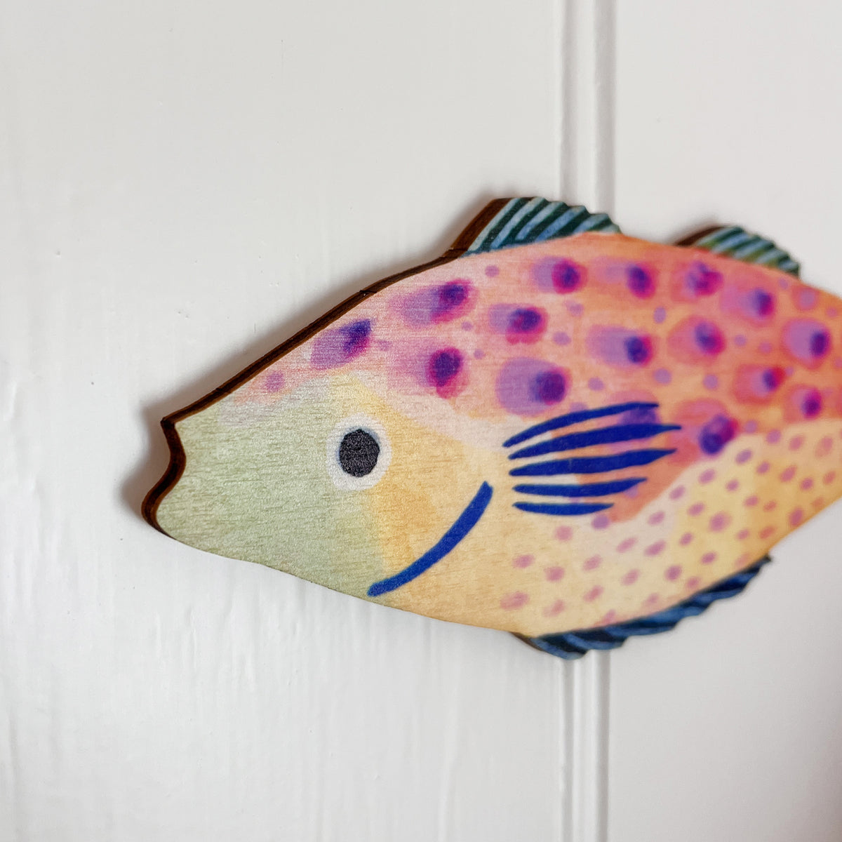 Close up of colourful fish decorations by Lee Foster-Wilson