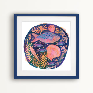 Art print of a colourful fish and shells painting by Lee Foster-Wilson displayed in a dark blue frame