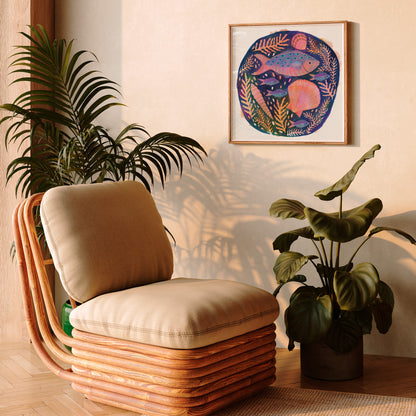 Art print of a colourful fish and shells painting by Lee Foster-Wilson displayed in a sunlit retro living room